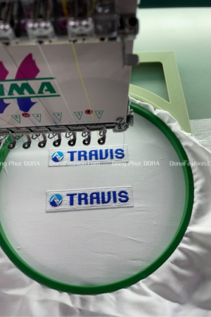 Thêu logo đồng phục TRAVIS  Thêu logo đồng phục TRAVIS