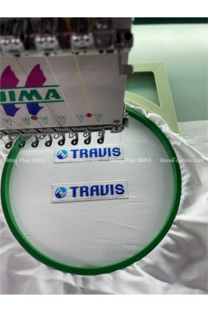 Thêu logo đồng phục TRAVIS  Thêu logo đồng phục TRAVIS